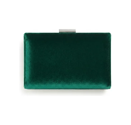 An emerald green velvet clutch bag