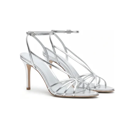 A pair of silver strappy heeled sandals